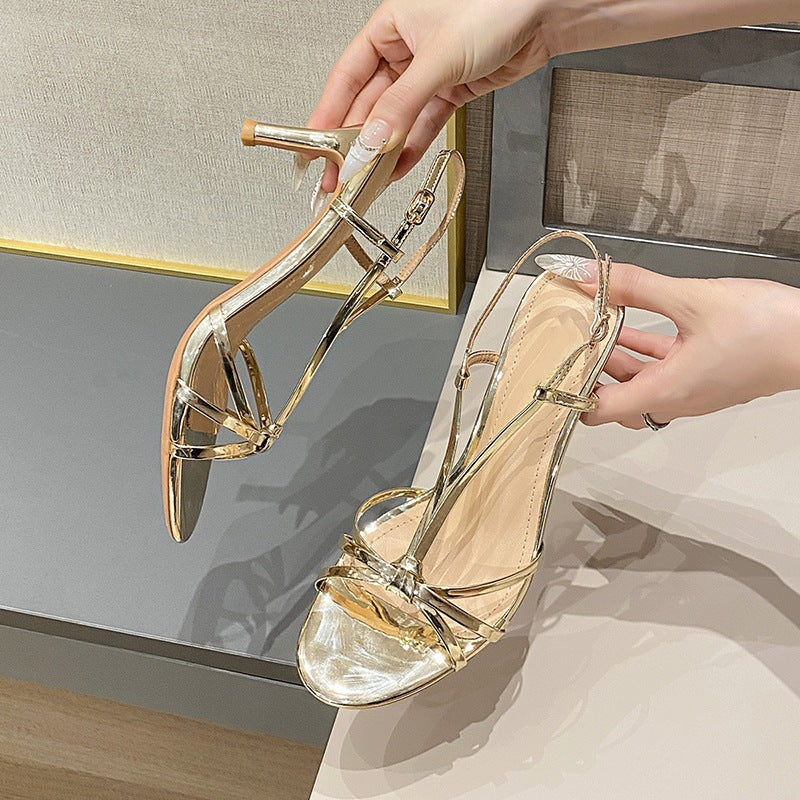 Gold strappy high heels