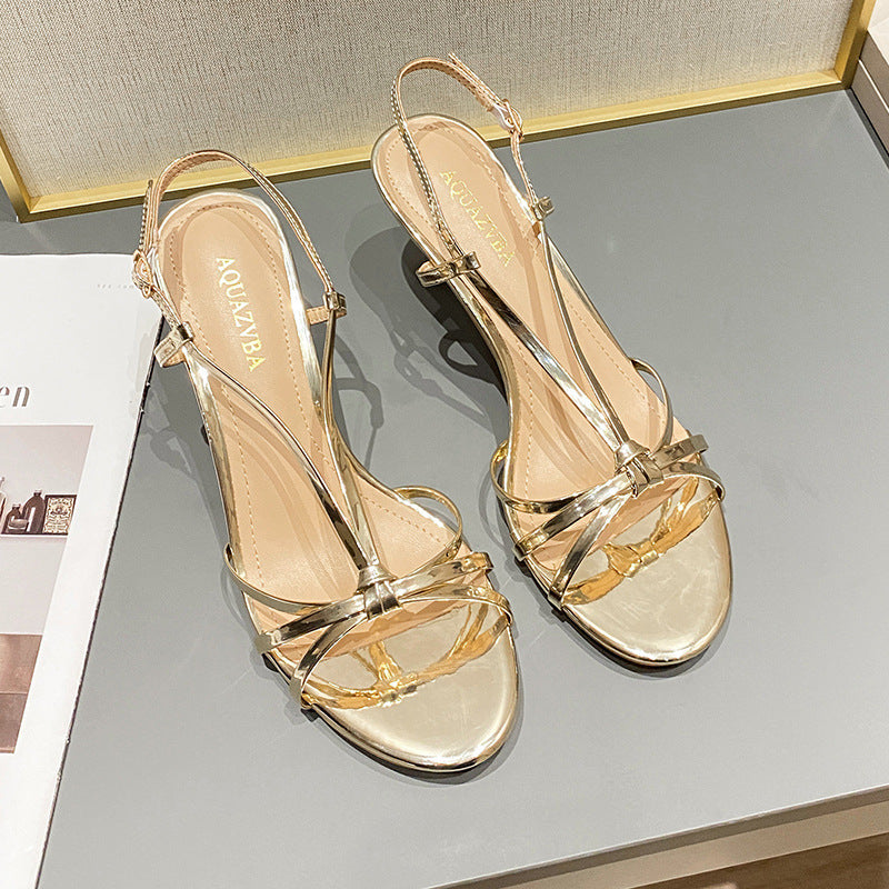 Gold strappy high heels